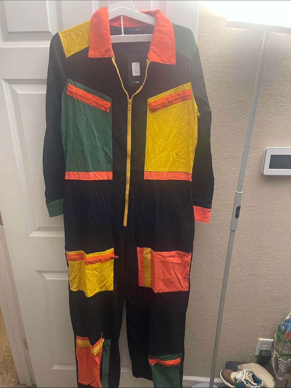 Fashion Nova Black Jumpsuit with Yellow Trim and Orange Accents